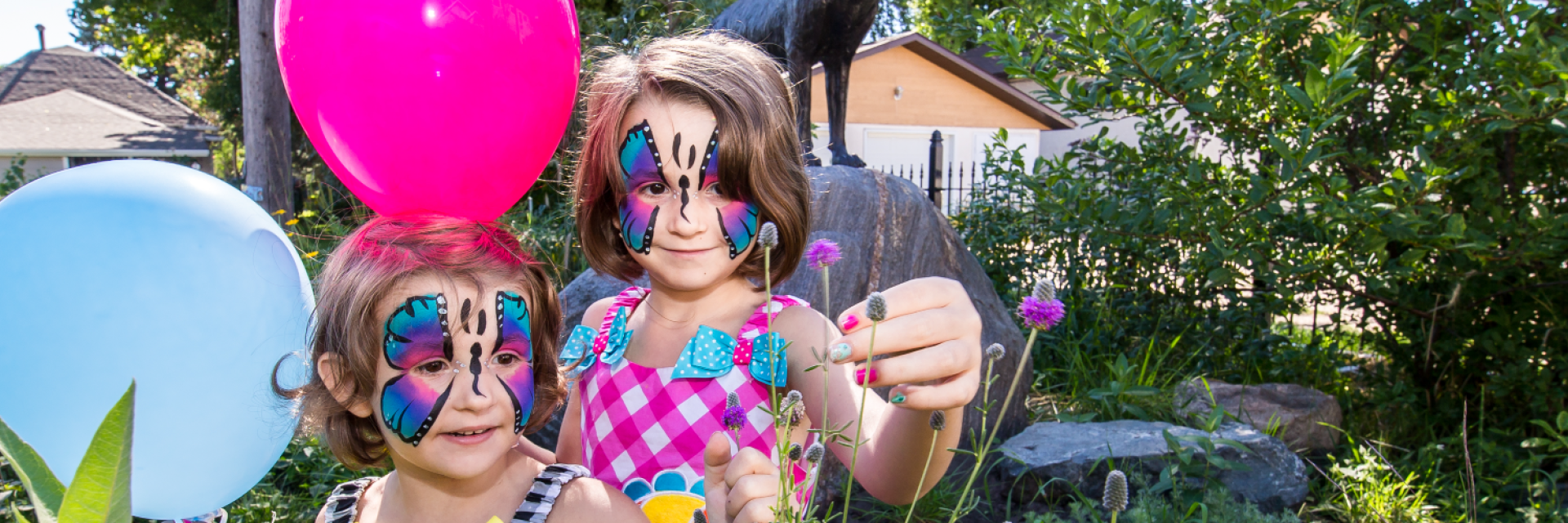 children with face paint and balloons 